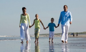 happy family walking along the beach; 's-Gravenzande, Netherlands