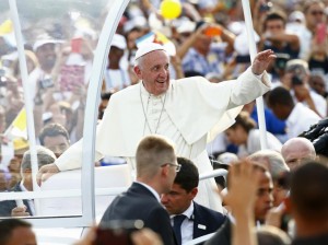 Pope Francis waves to the crowd upon arriving to give the first mass of his visit to Cuba in Havana's Revolution Square, September 20, 2015. REUTERS/Tony Gentile